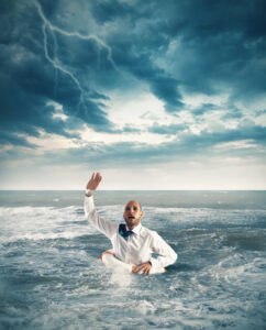 Businessman in the ocean asking for help